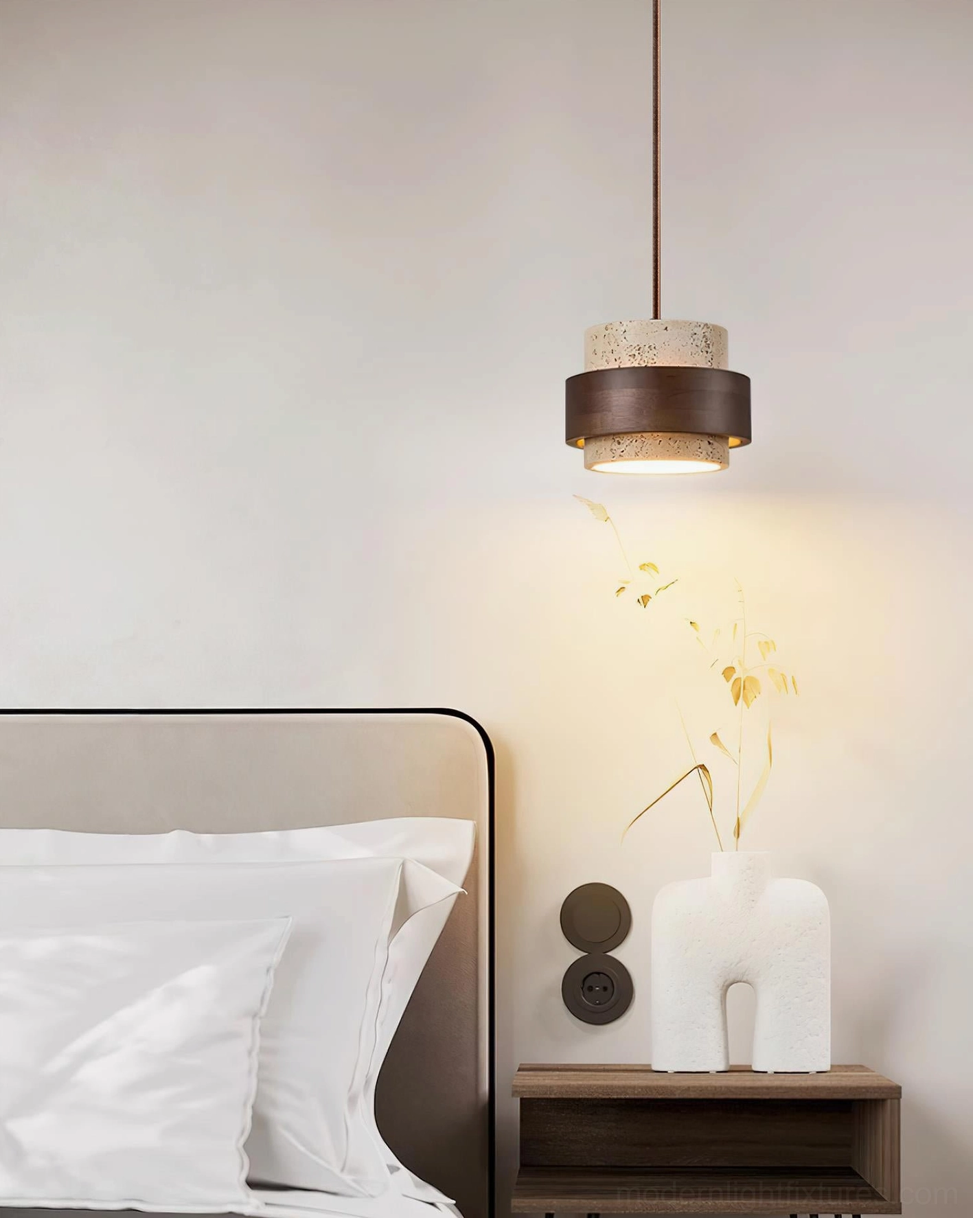 Single travertine pendant lamp sculptural form, modern minimalist design focal point in neutral interior