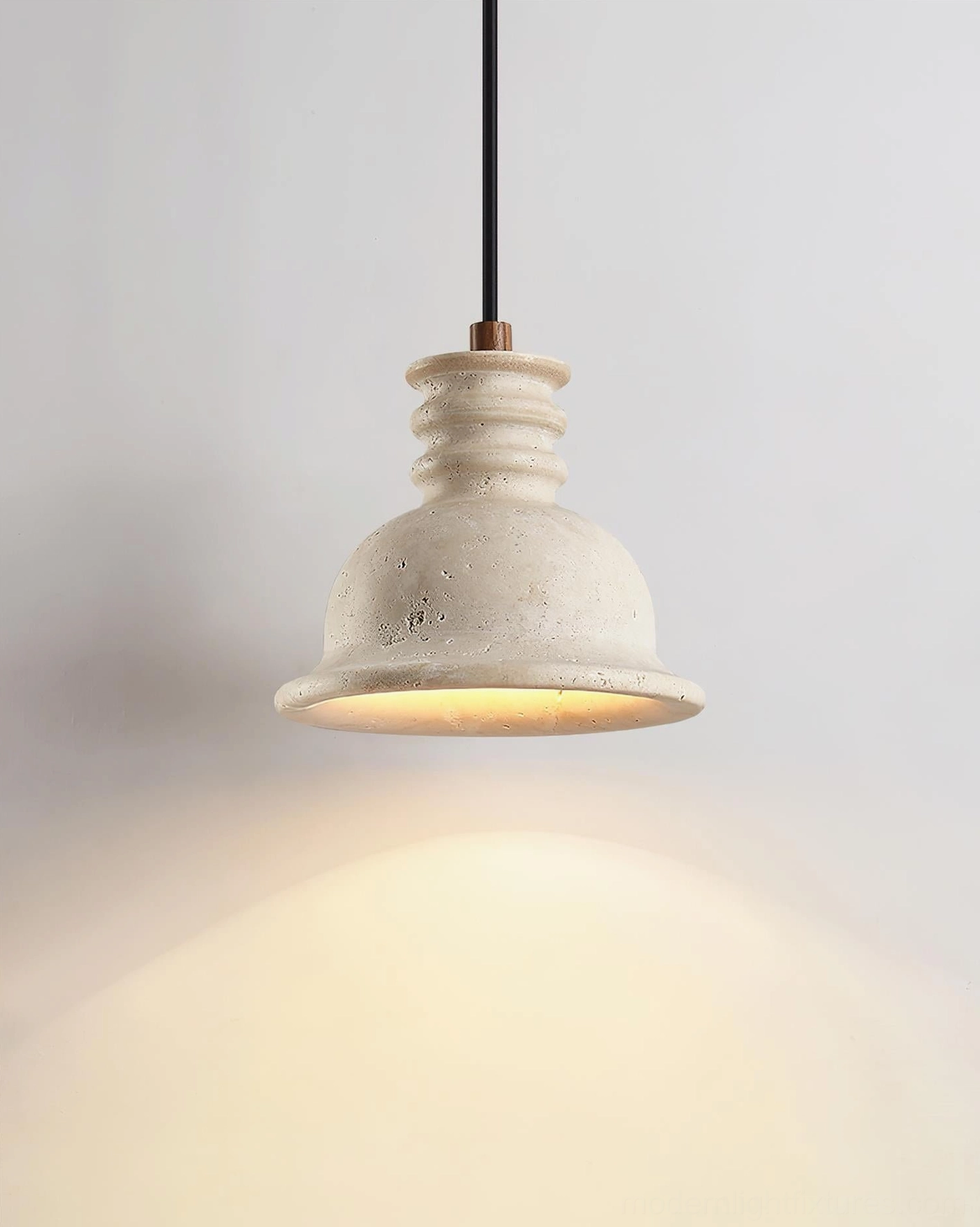 Travertine pendant light with adjustable cord length demonstrating flexible installation options for various ceiling heights