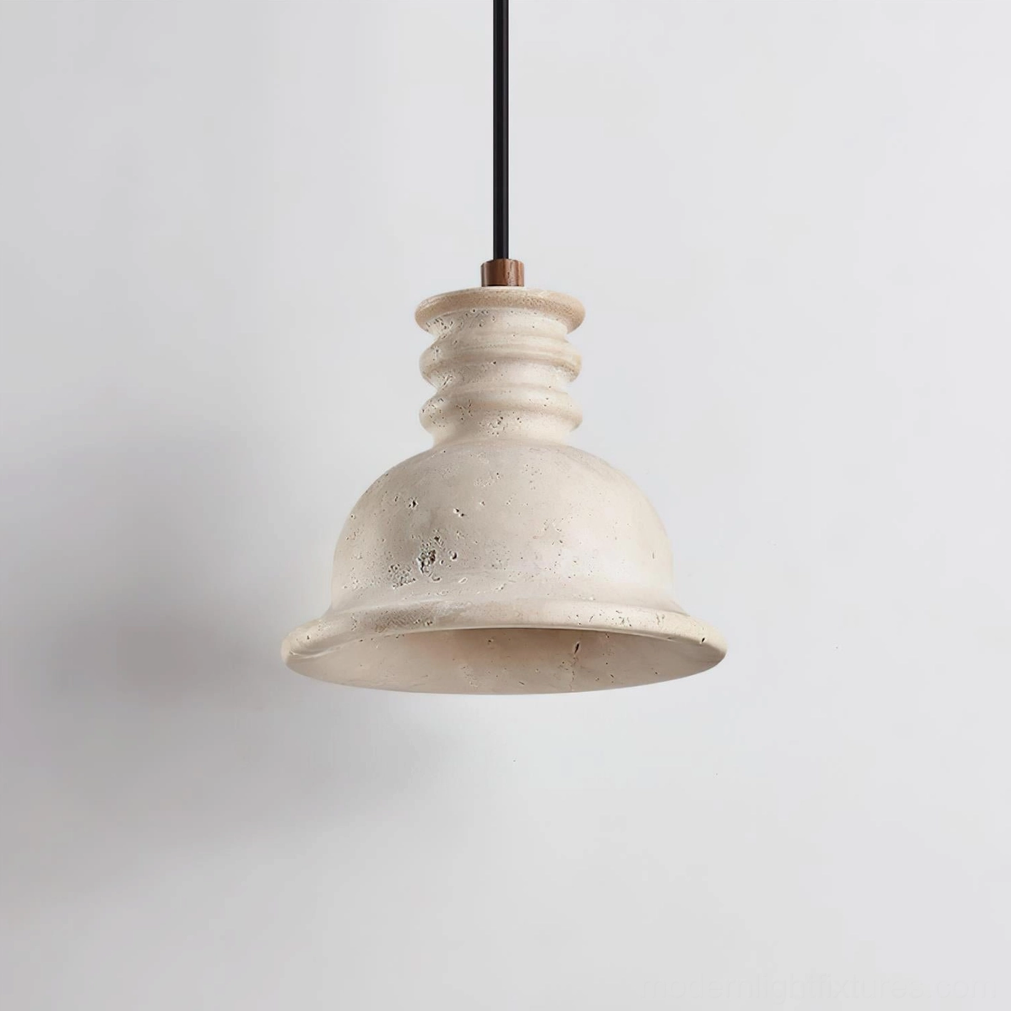 Travertine pendant light in contemporary bedroom setting creating warm intimate ambient lighting with minimalist aesthetics