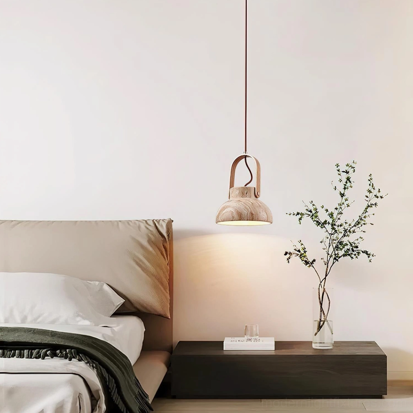 Modern travertine pendant light above bedroom nightstand, warm minimalist Scandinavian bedroom lighting