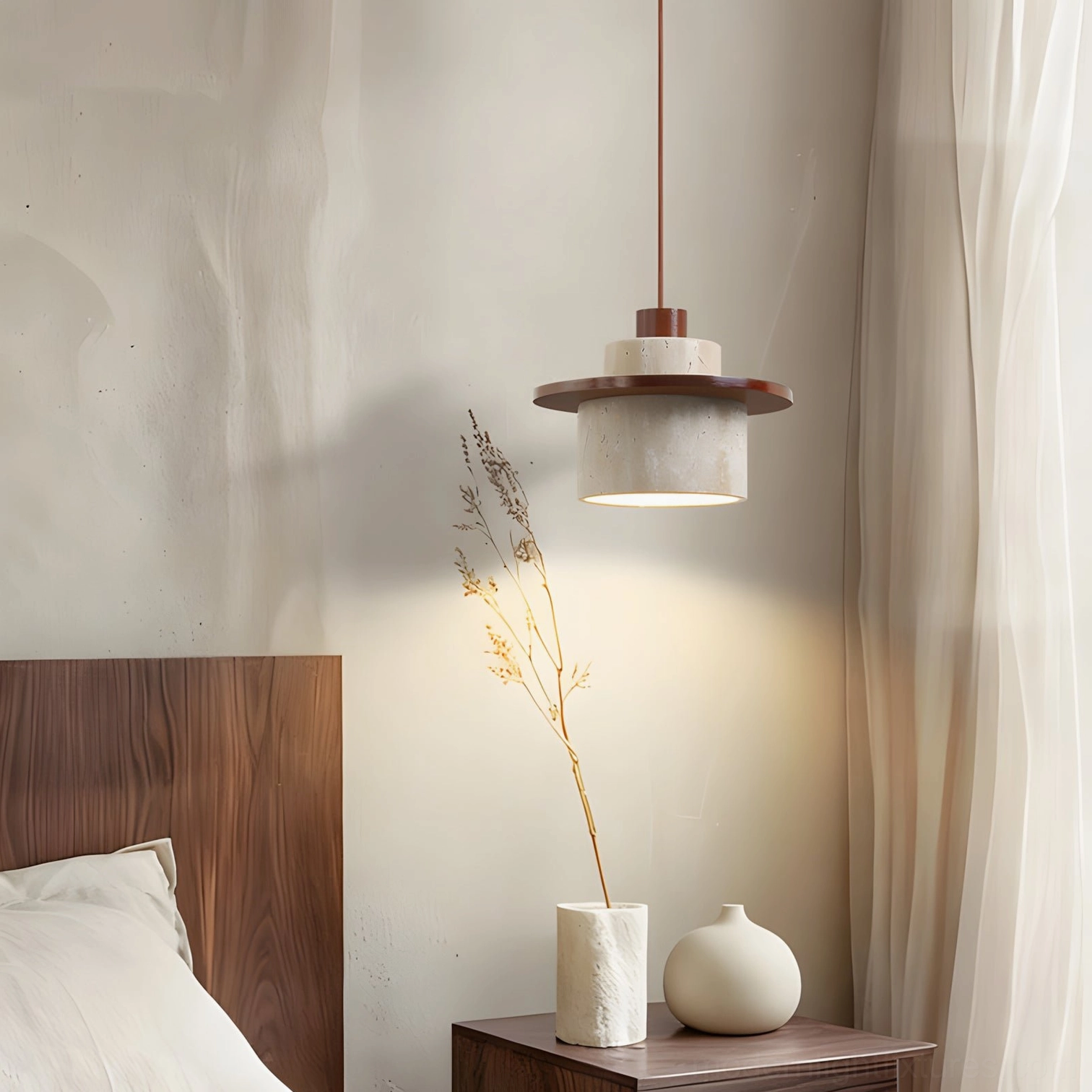 Travertine pendant light beside bed in minimalist bedroom wabi-sabi aesthetic