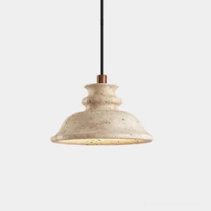 Beige travertine dome pendant light with sculptural stone shade and brass metal collar, front studio view