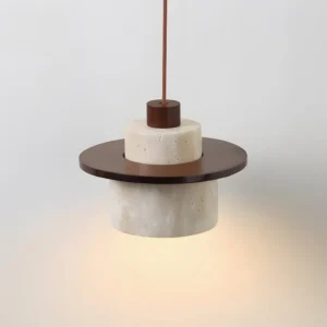 Bottom view of travertine pendant lamp showing warm diffused light through natural stone
