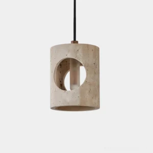 Travertine pendant light with circular cutout, front close-up view showing sculptural concrete texture and geometric aperture design