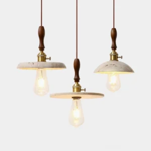 Cask travertine pendant light close-up detail shot showing natural stone pores and gold metal hardware with exposed Edison bulb