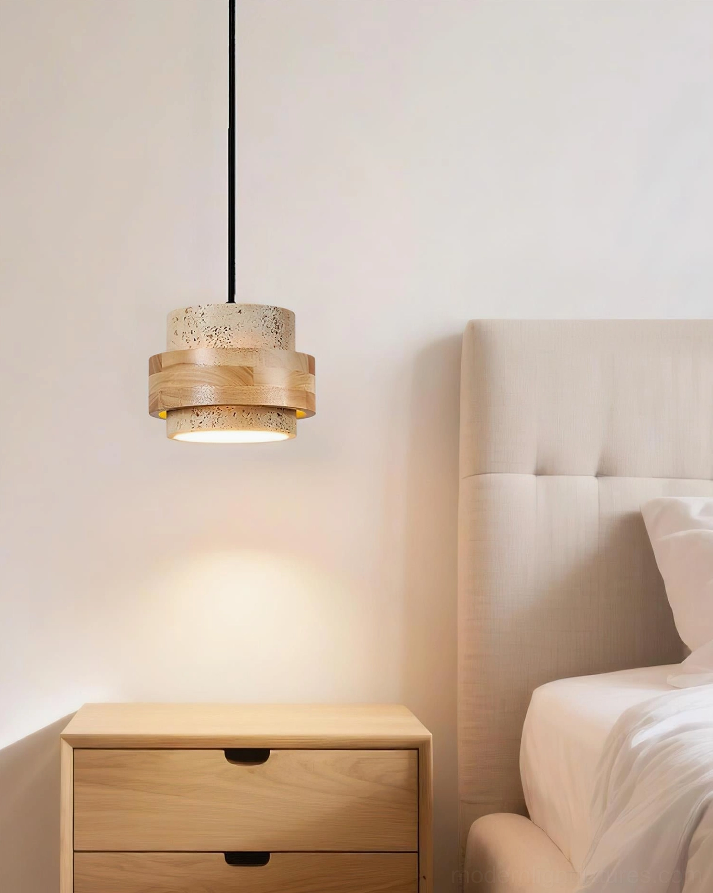 Travertine pendant light installation in contemporary entryway, architectural lighting statement entrance