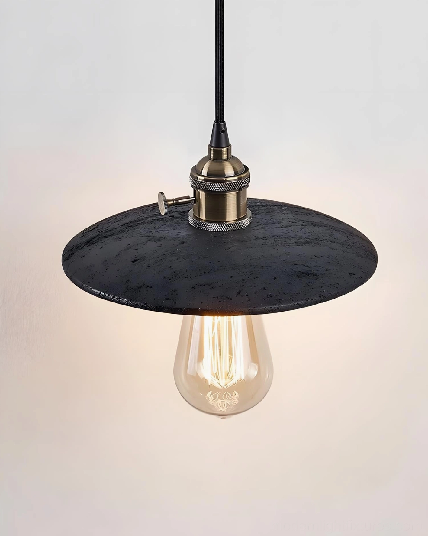 Travertine pendant light installed in contemporary living space with minimalist decor