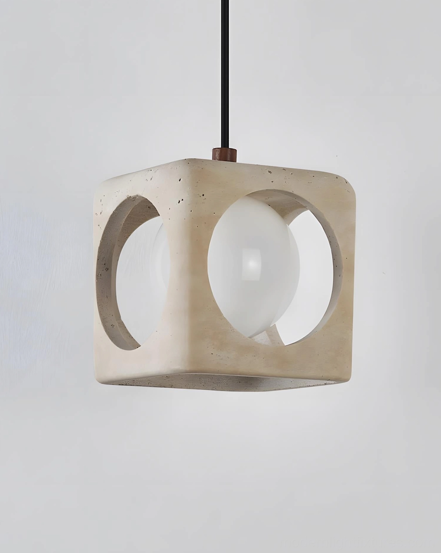 Hollowa travertine pendant light demonstrating light diffusion through glass bulb and stone arch openings