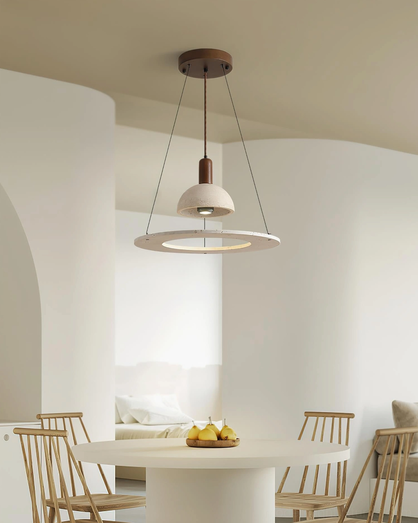 Travertine pendant light hanging above modern round dining table in contemporary home interior