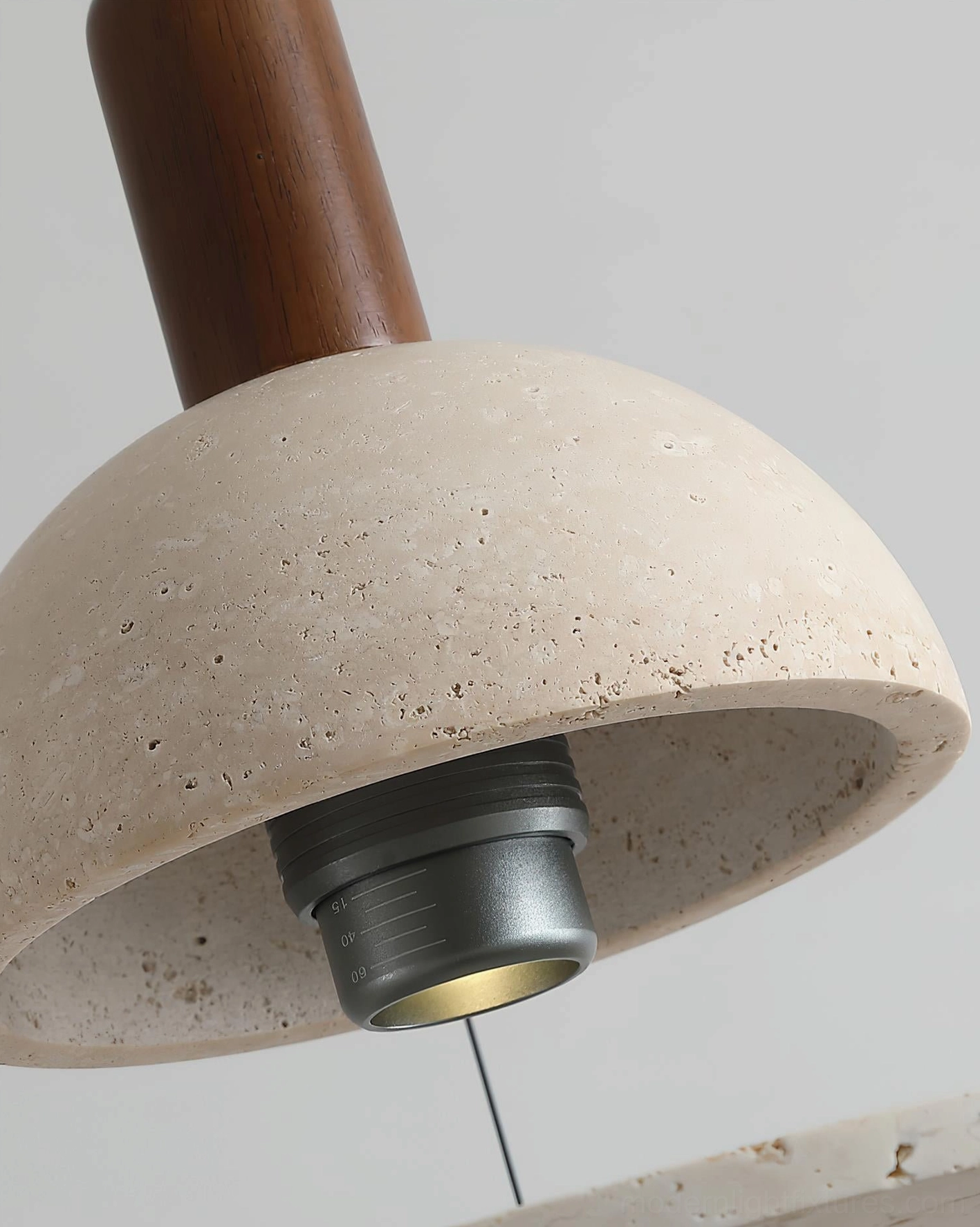 Travertine pendant light fixture front perspective showing dome and offset ring silhouette