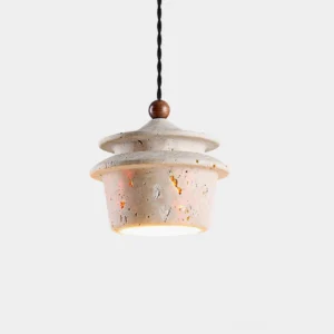 Travertine pendant light with twisted black cord hanging from white background, showing porous stone texture and warm interior glow