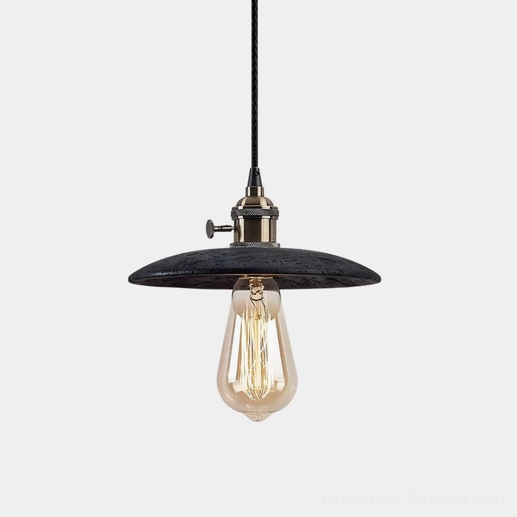 Travertine pendant light with exposed brass bulb and metal hardware, front view on white background