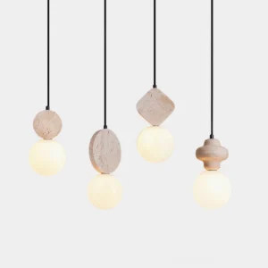 Cenari travertine pendant light collection featuring diverse geometric stone bases with frosted glass globes in minimalist Nordic design