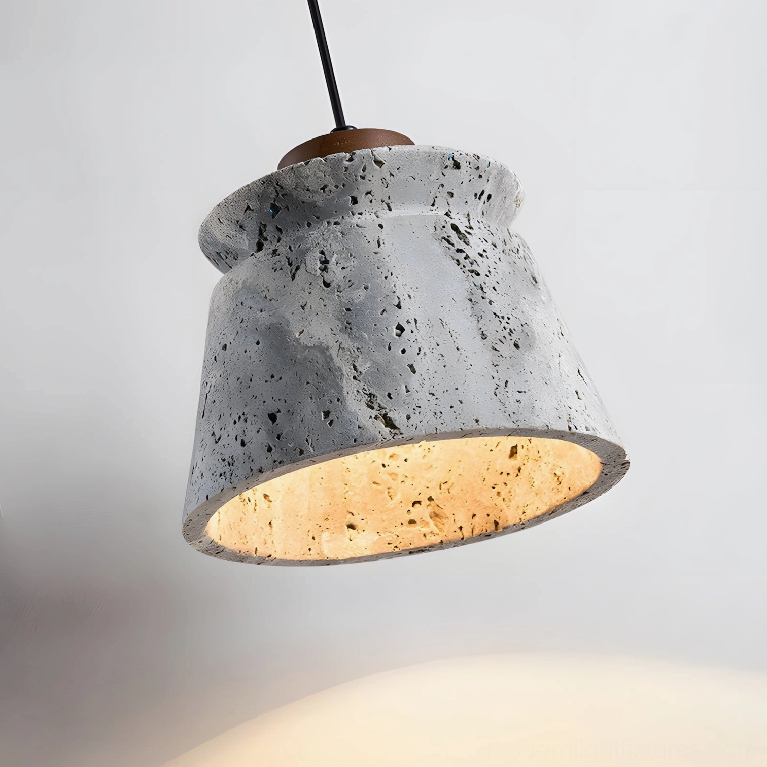 Travertine pendant light installation showing adjustable wire and height customization for modern spaces