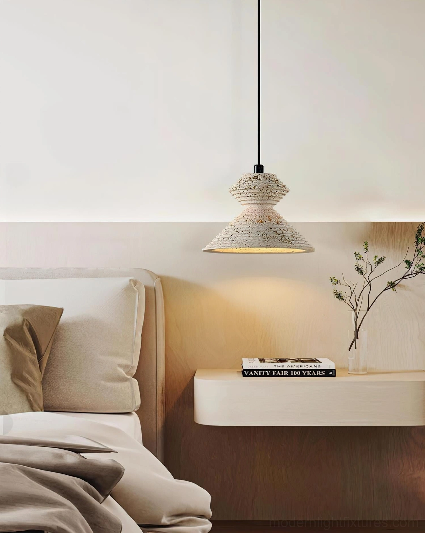 Travertine pendant light cluster arrangement above kitchen island in contemporary home setting