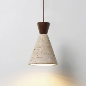 Modern travertine pendant lamp illuminated, warm ambient downlight, organic wabi-sabi aesthetic