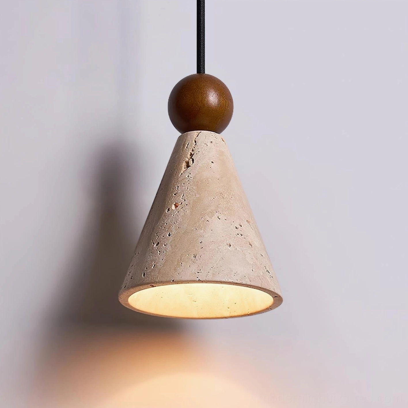 Travertine stone pendant light showing natural porous texture and warm beige color variations