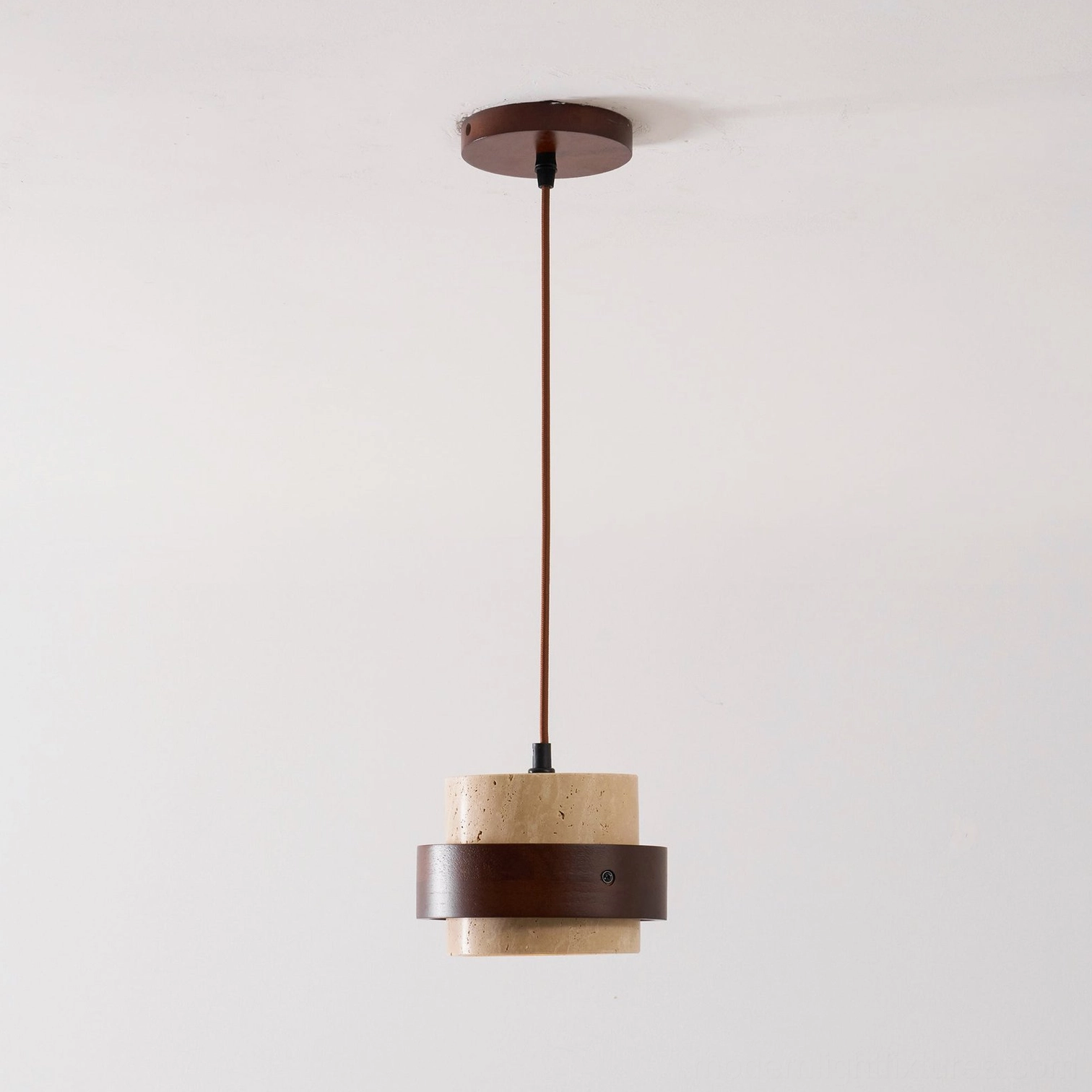 Travertine pendant light fixture product photography on neutral background, professional documentation view