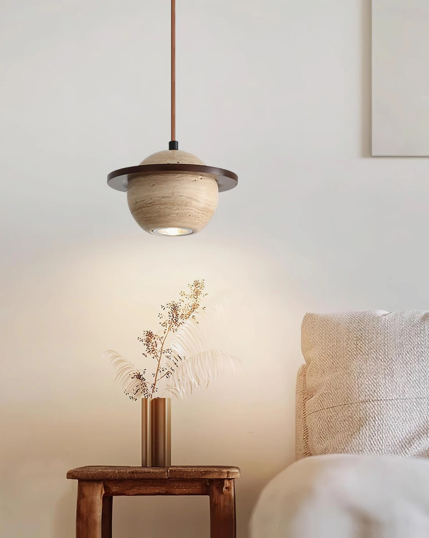 Contemporary travertine pendant light demonstrating soft diffused downward glow, ambient lighting for modern spaces