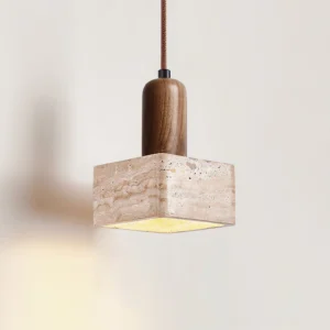 Square travertine shade pendant light with dark wood top, angled front perspective showing warm glow