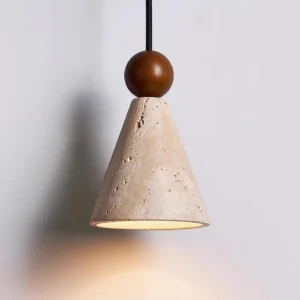 Modern travertine stone pendant light with warm illumination and downlight casting soft shadows