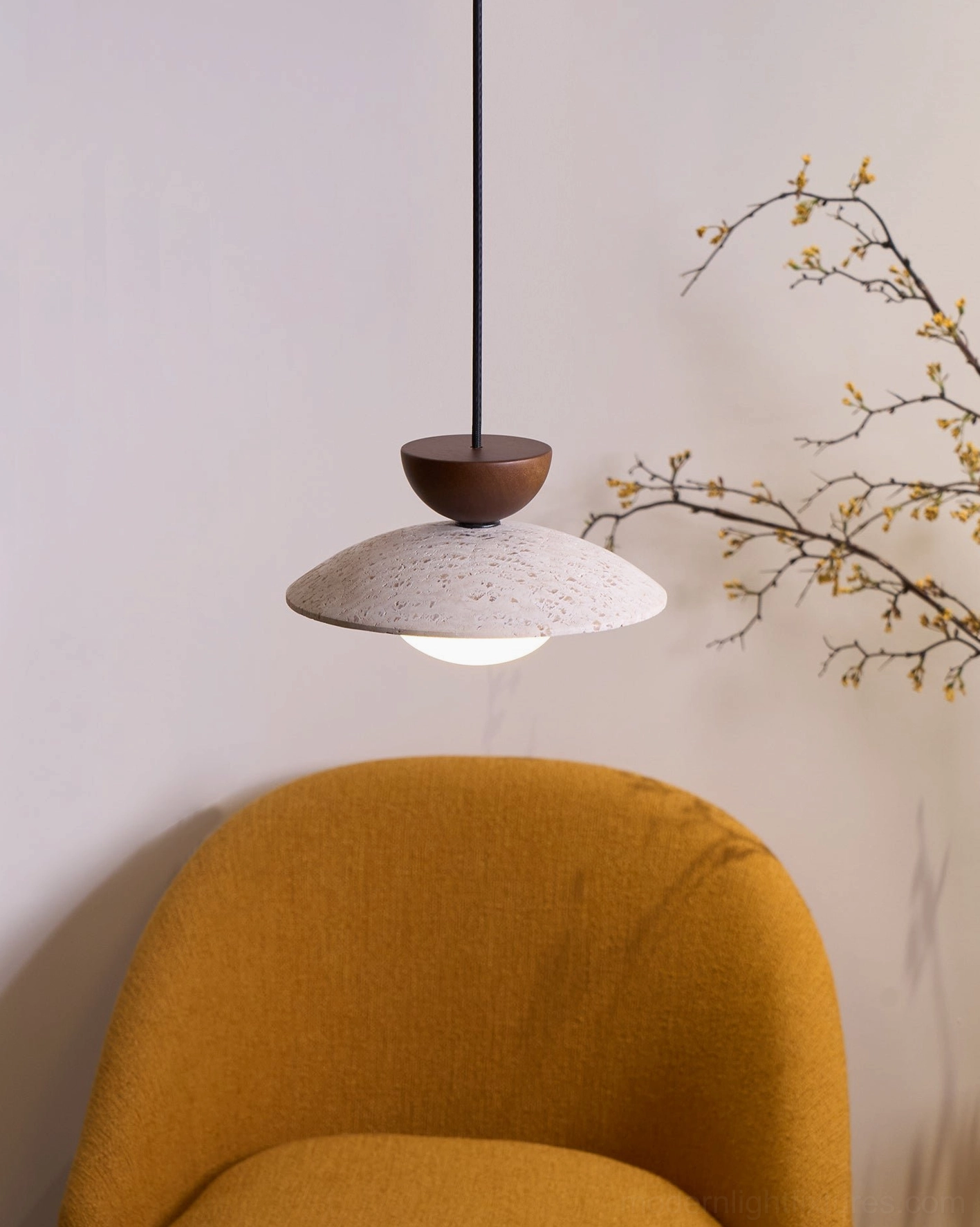 Multiple Tia travertine pendant lights showing color variation and natural stone differences