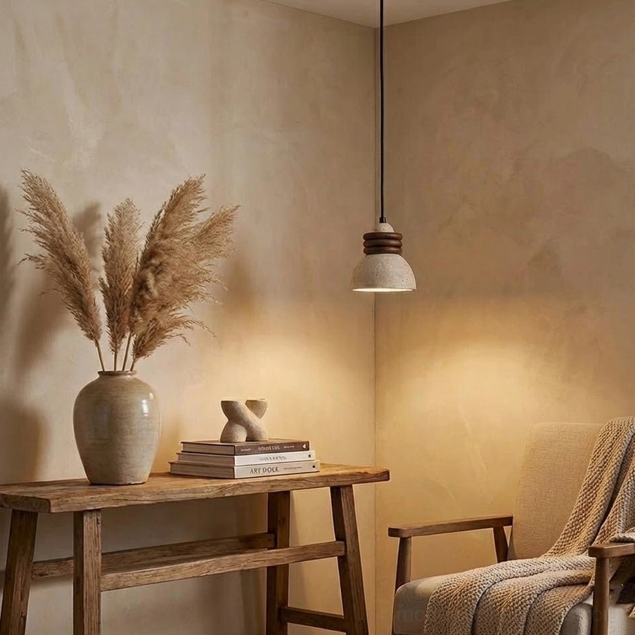 Multiple travertine pendant lights in linear arrangement above dining table in modern residential interior