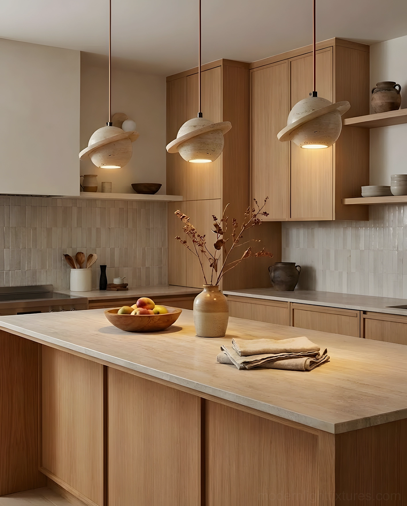 Three travertine sphere pendant lights installed above modern wooden kitchen island, clustered installation with varied heights