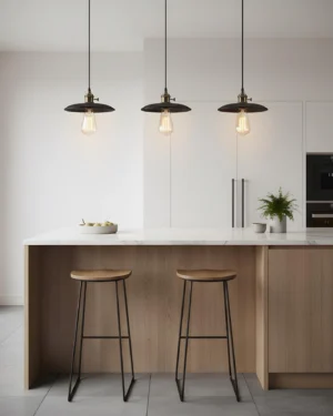 Set of three travertine pendant lights installed over modern kitchen island with warm ambient lighting