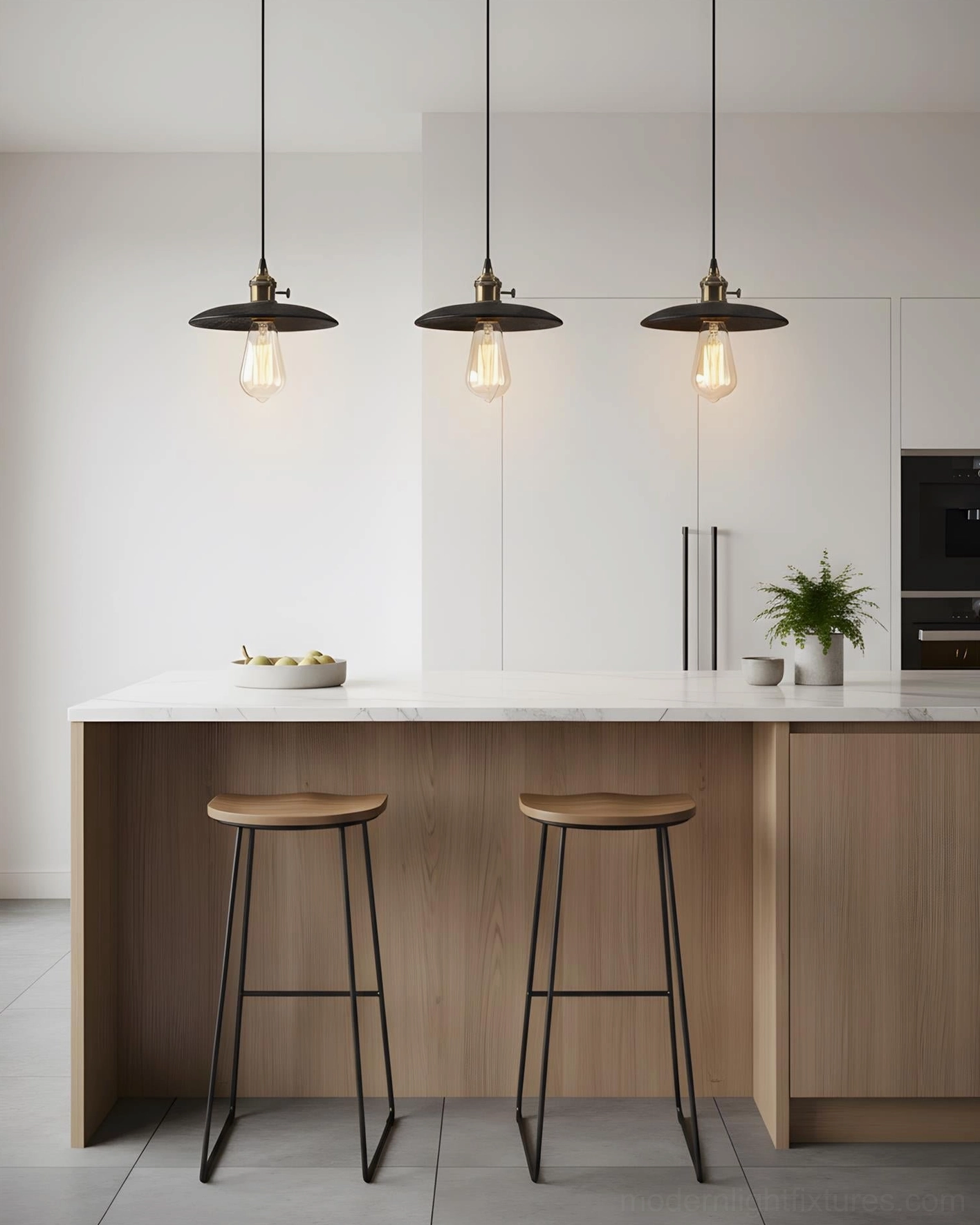 Set of three travertine pendant lights installed over modern kitchen island with warm ambient lighting
