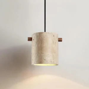 Single travertine pendant light fixture, angled perspective showing natural stone texture and warm interior lighting