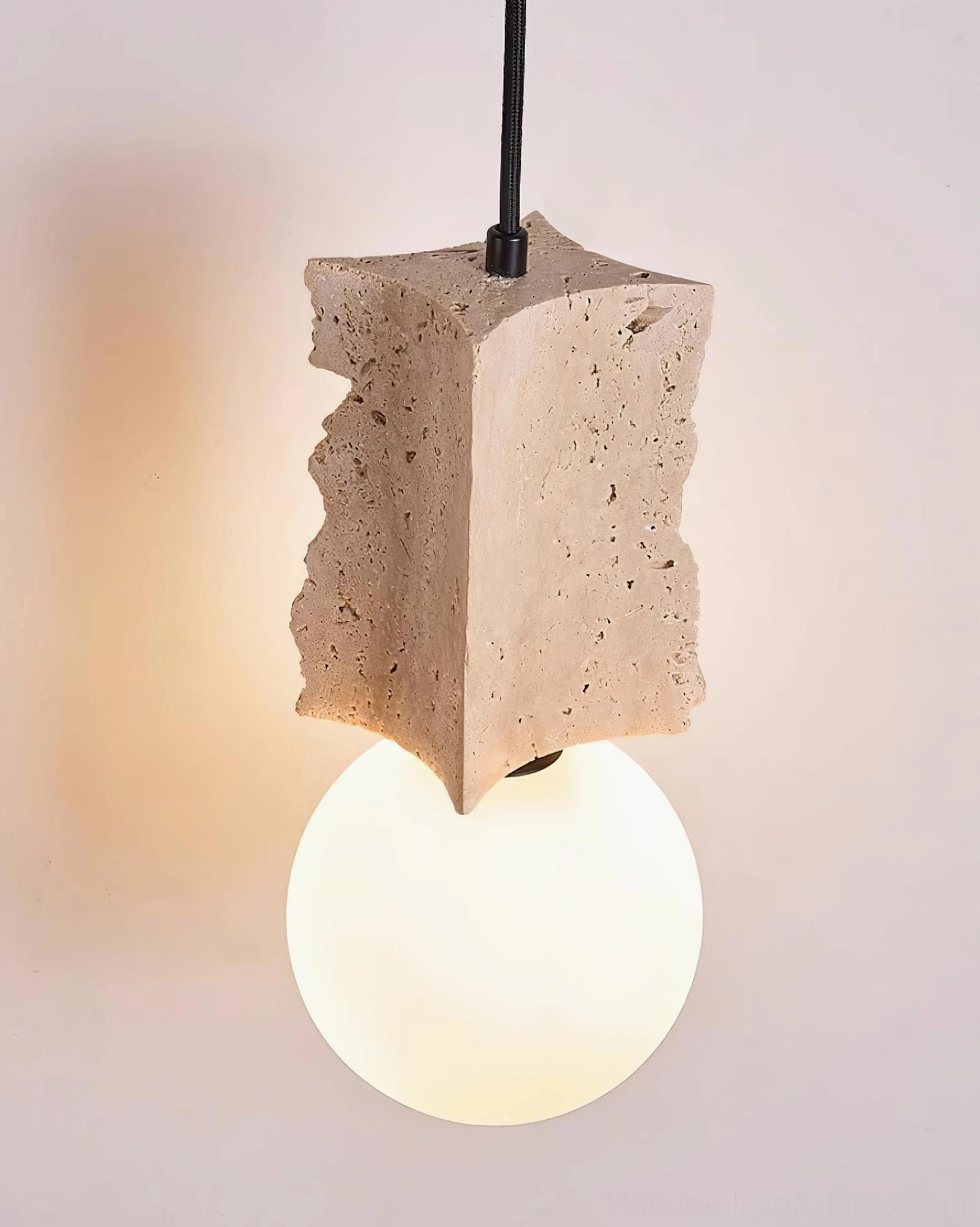 Travertine pendant light fixture detail showing irregular stone surface texture and authentic natural material characteristics