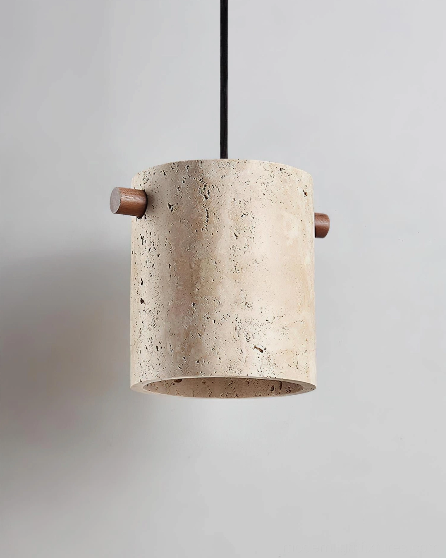 Travertine pendant light fixture detail emphasizing natural stone texture and craftsmanship quality
