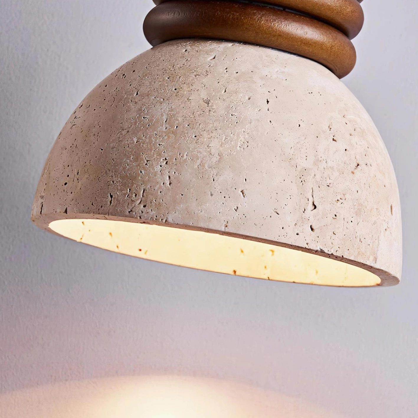 Travertine pendant light three-head array showing sculptural wooden ring framework and natural stone sphere shades in detail