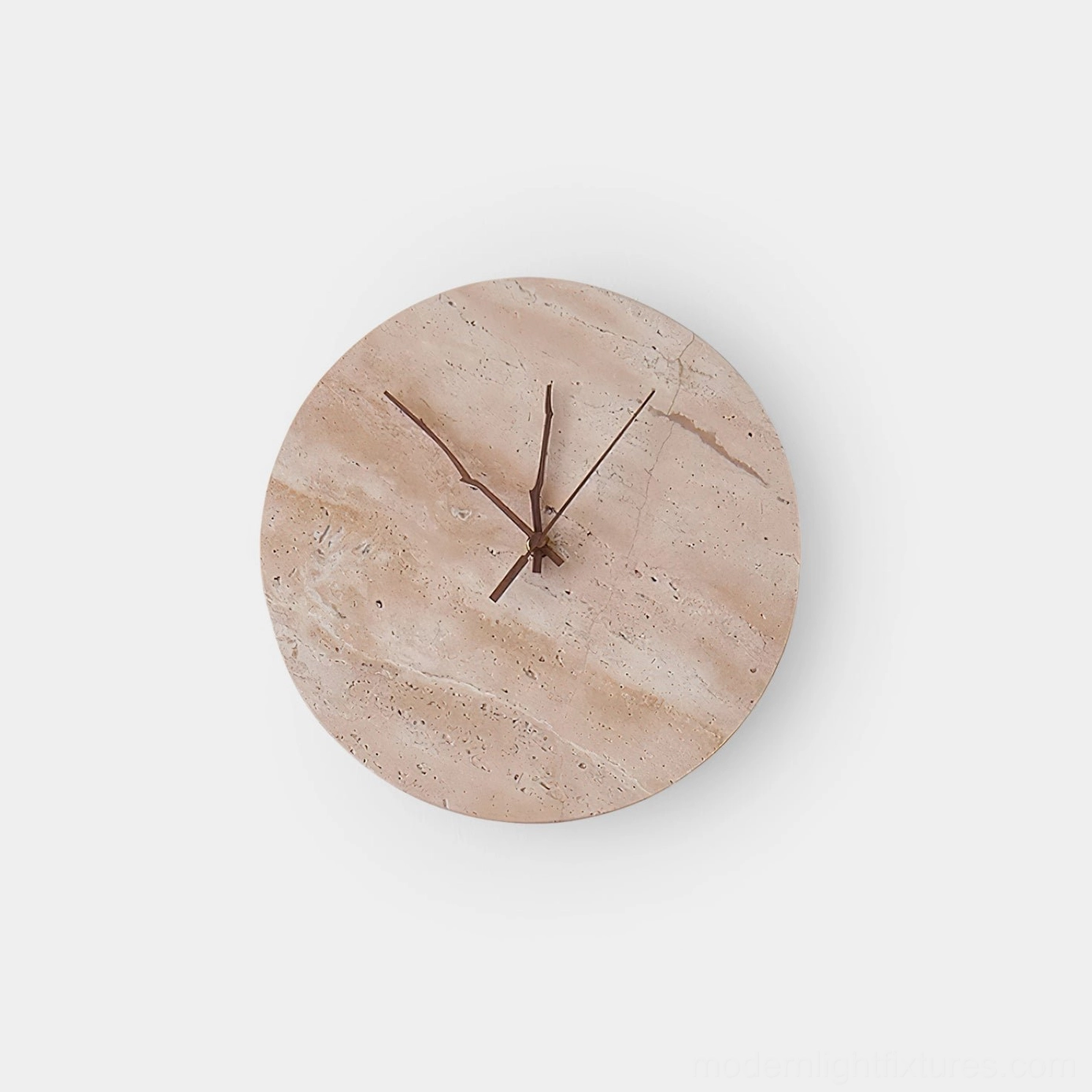 Round travertine clock wall sconce with dark wood clock hands on white studio background