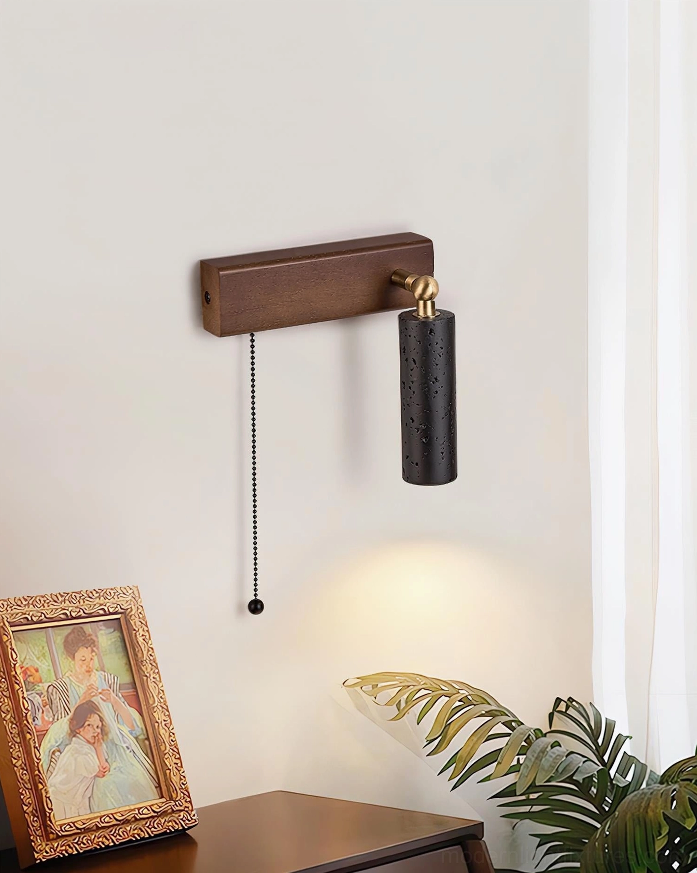 Side angle view of minimalist travertine wall sconce with black shade mounted in rustic wabi-sabi home corner
