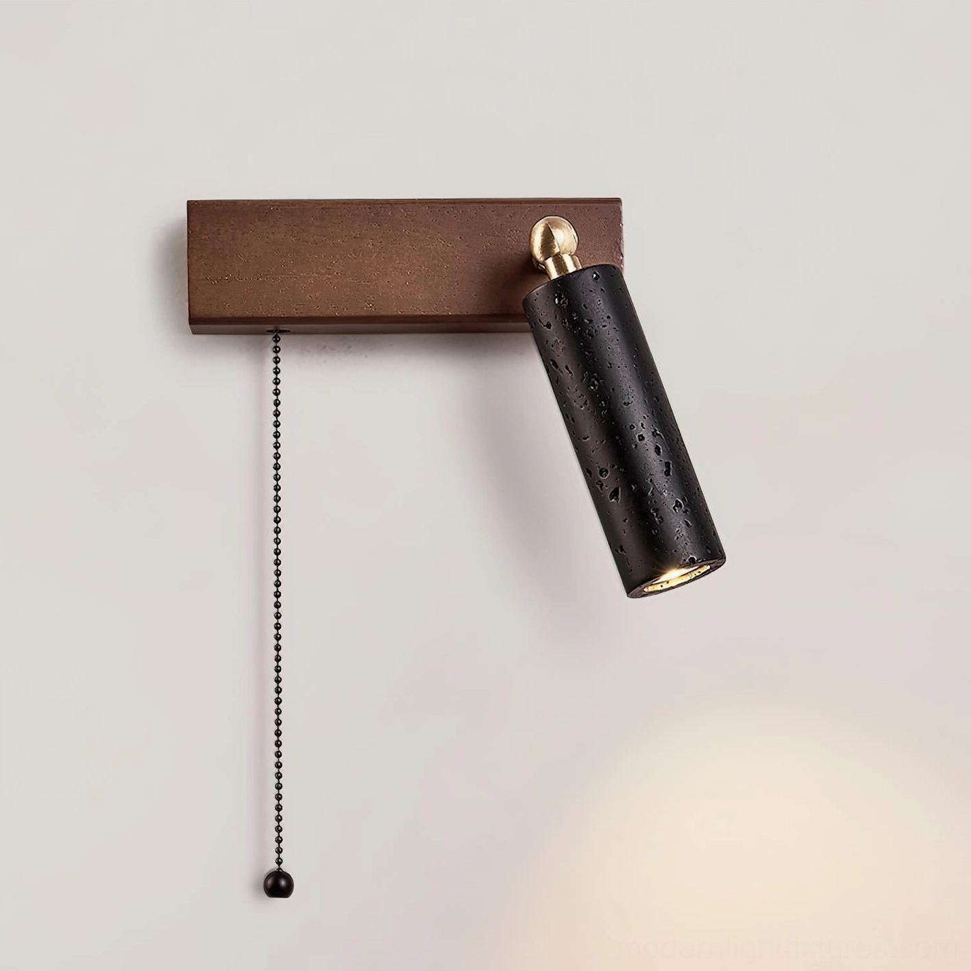Travertine pull chain wall sconce with natural stone texture – contemporary sculptural bedside fixture