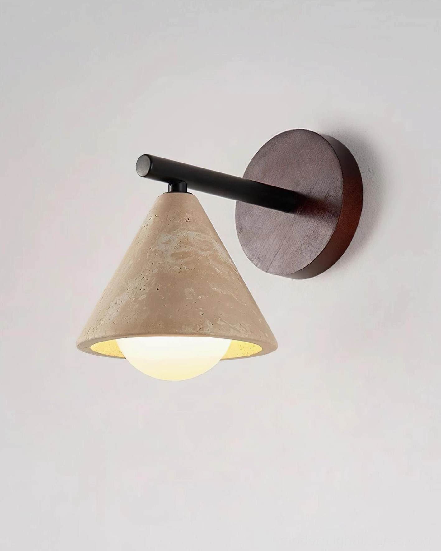 Travertine wall sconce demonstrating natural stone character and authentic wabi-sabi aesthetics