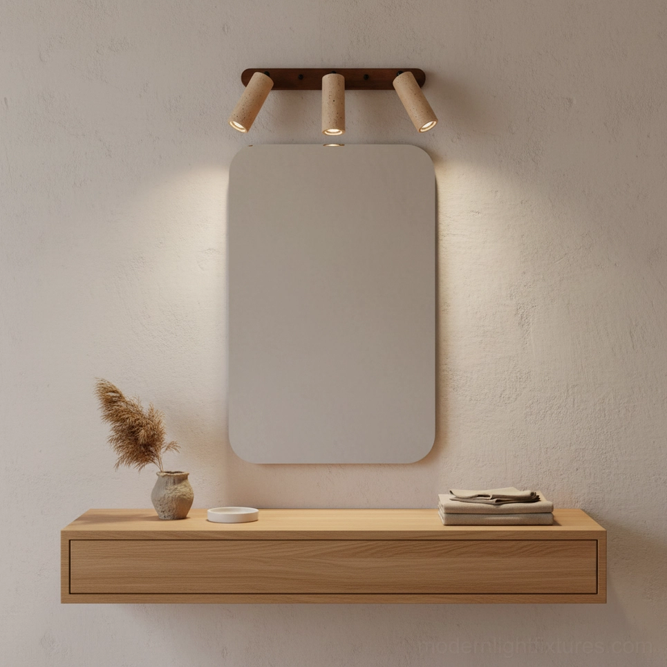 Ricerca travertine wall sconce close-up of cylindrical stone diffuser showing porous texture and light diffusion
