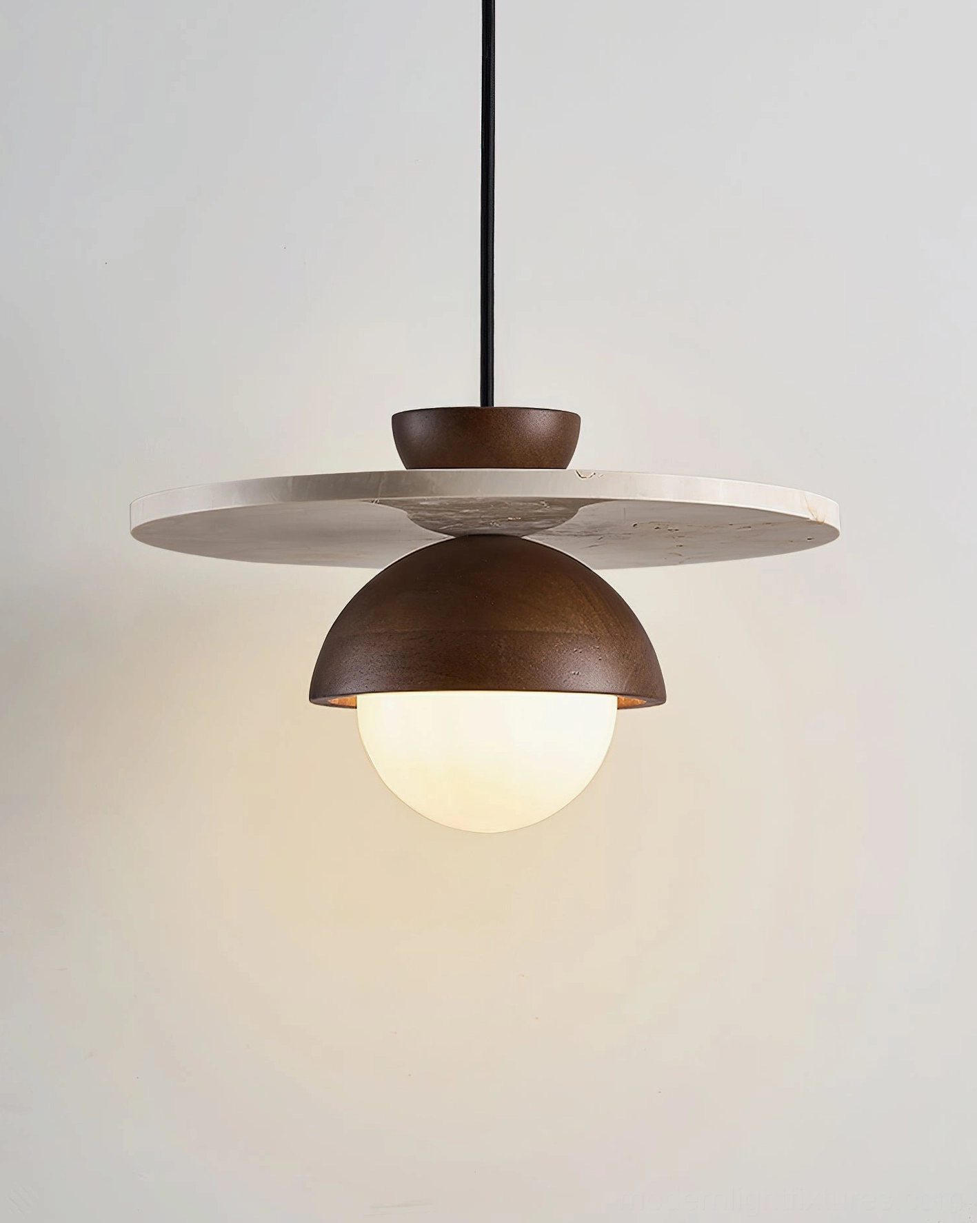 Mid-century modern travertine pendant lamp with frosted glass globe and dark wood shade detail