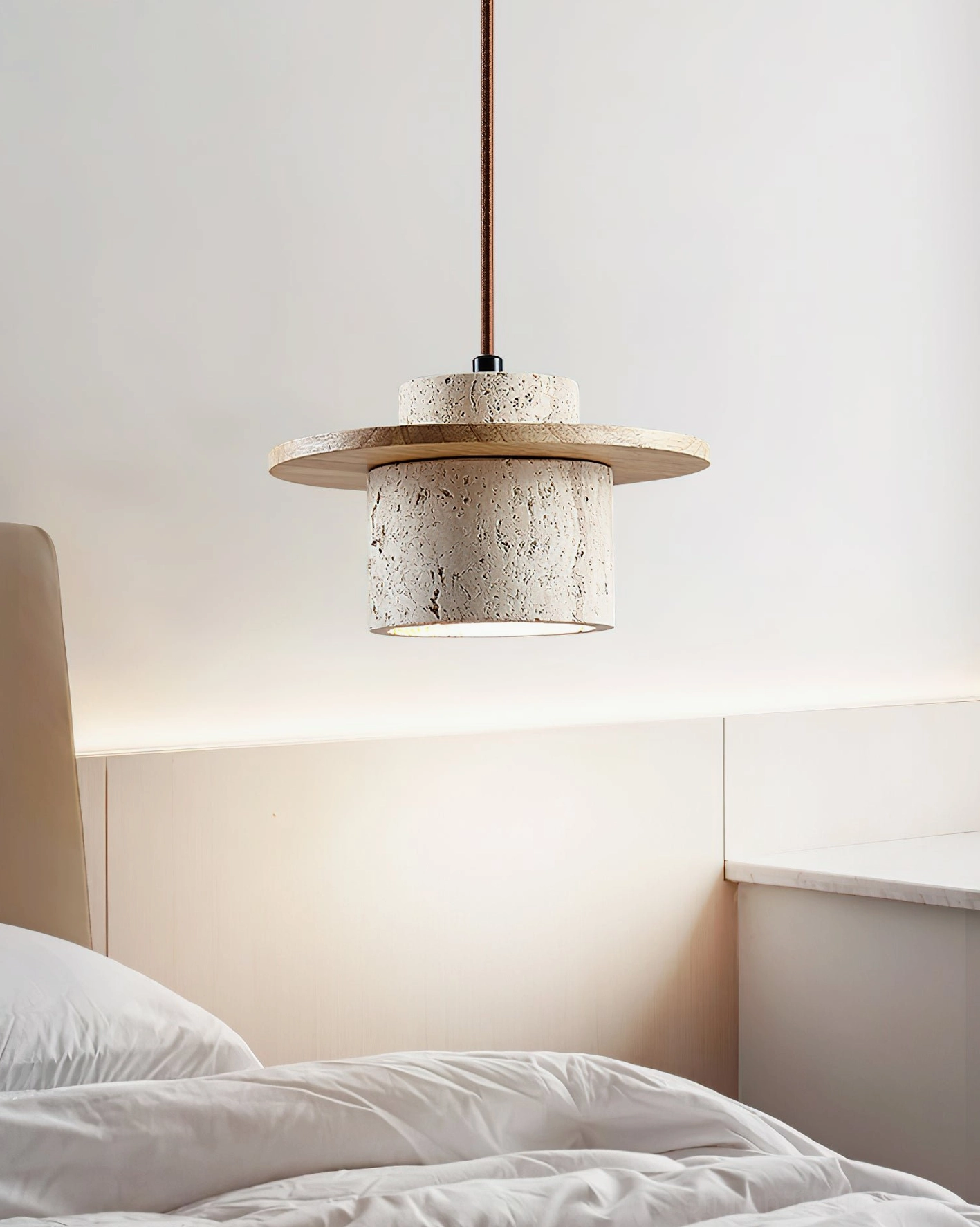 Travertine stone hanging light with wood cap, sculptural detail emphasizing organic surface character and artisanal craftsmanship
