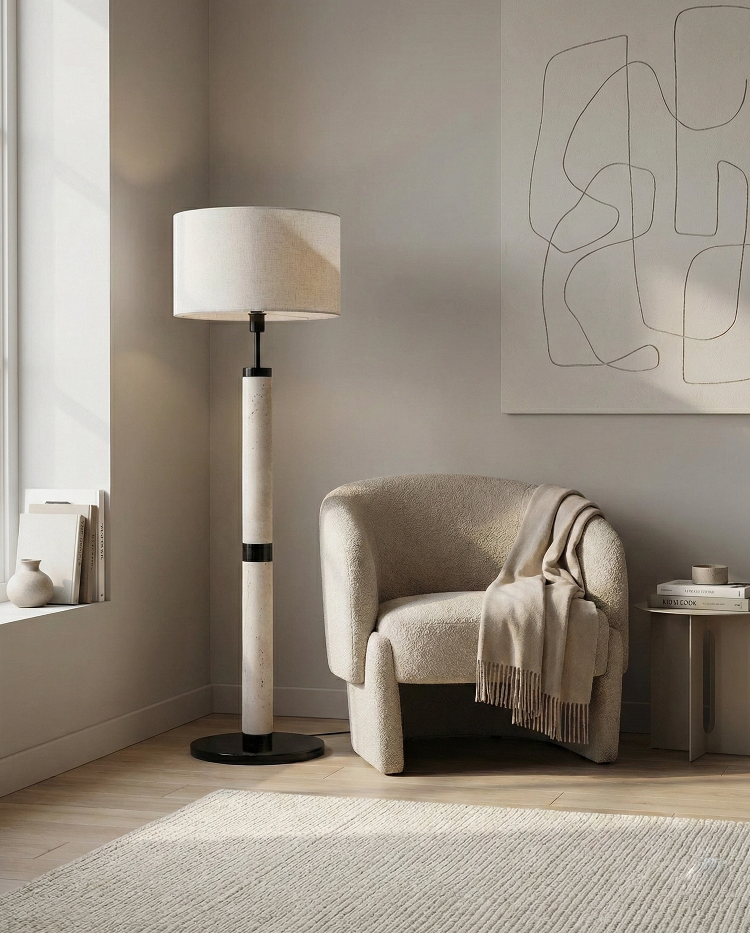 Minimalist travertine floor lamp beside armchair - sculptural standing light in modern living room