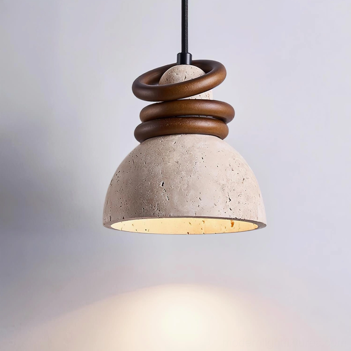 Travertine pendant lamp side profile showing stacked walnut wooden details and soft warm downward light diffusion