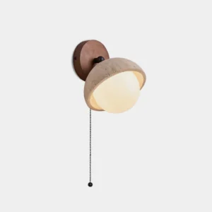 Natural travertine stone wall sconce with pull chain, front view showcasing warm beige half-dome shade and wooden base