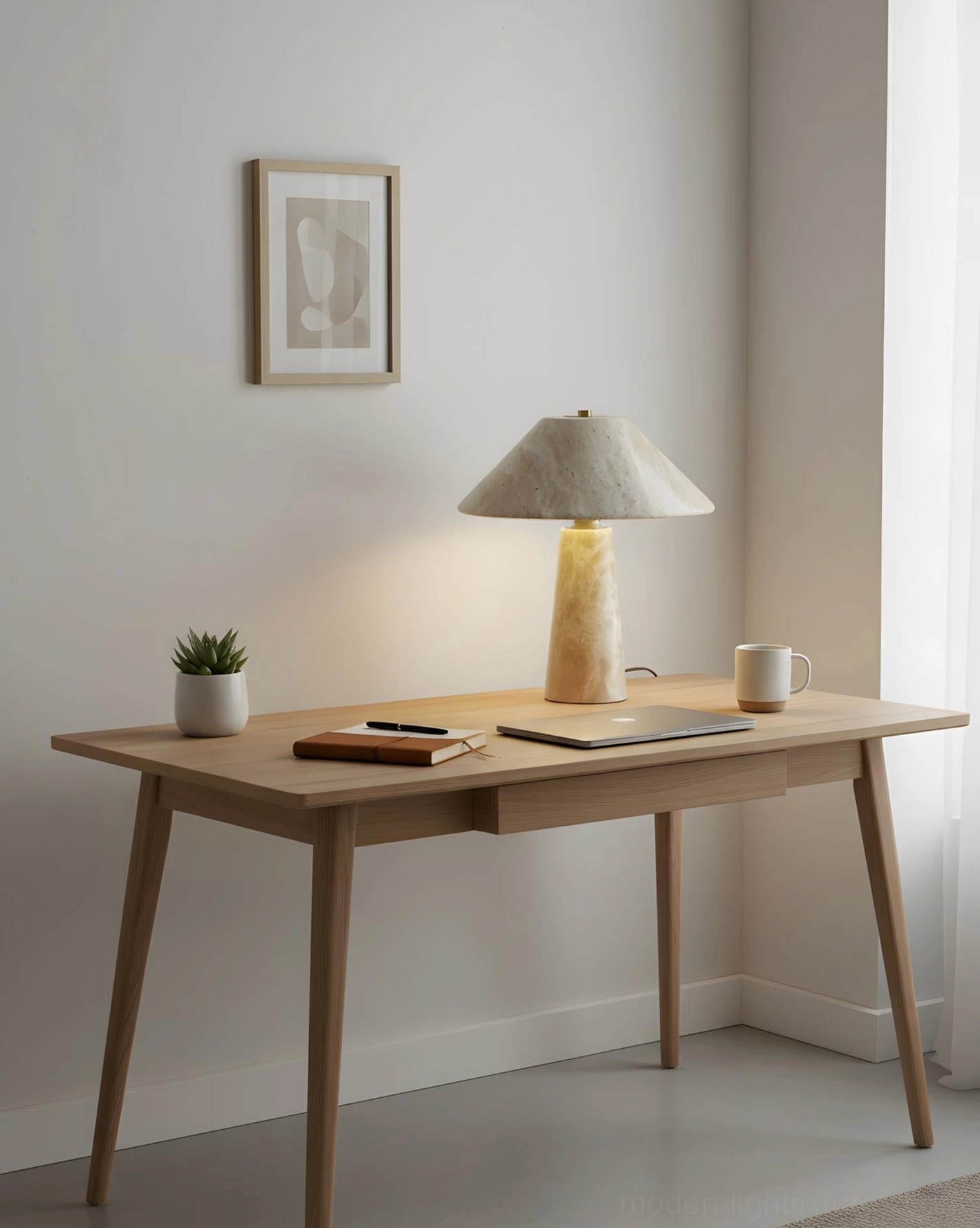Study desk travertine lamp on slim oak table with small potted plant and coffee mug in home study corner