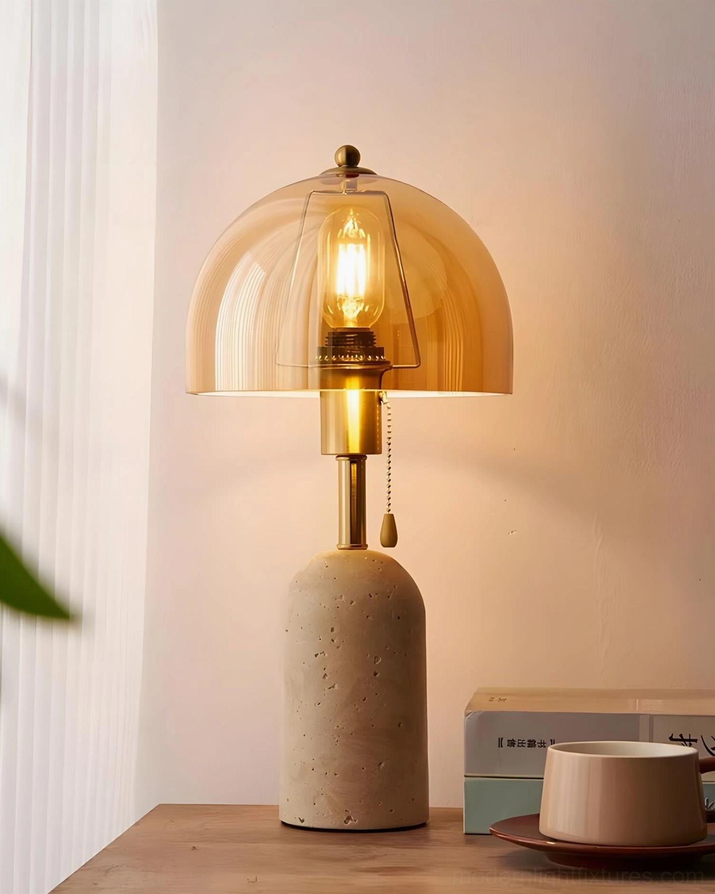 Travertine table lamp with amber tinted glass in warm home setting