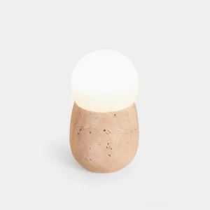 Travertine stone table lamp with frosted glass globe, minimalist modern design - front flat lay view