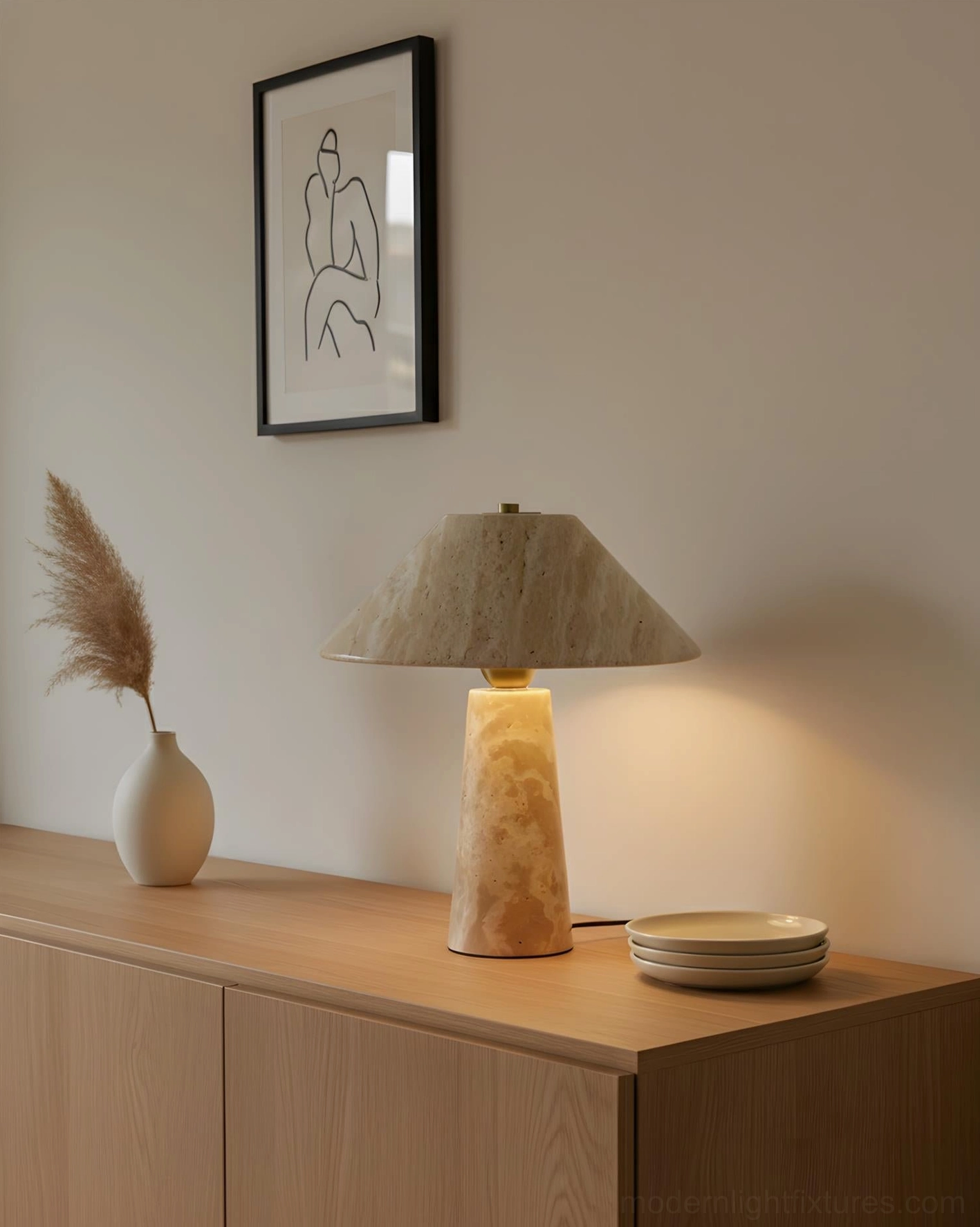 Minimalist travertine console lamp displayed on wood side cabinet with pampas grass and decorative accessories