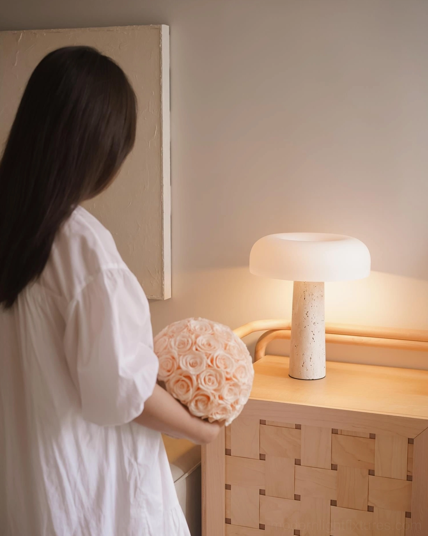 Matte white travertine table lamp color option shown in contemporary modern living space