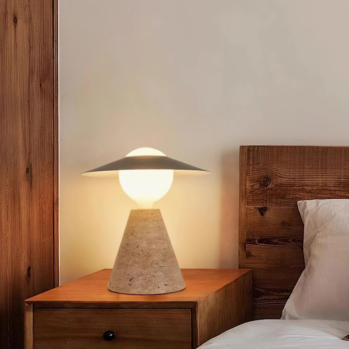 Industrial travertine table lamp in rustic neutral bedroom decor